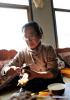 March 11, 2019 -- Ji Qiumei slices cooked yak meat at a herdman`s home in southwest China`s Tibet Autonomous Region, Feb. 26, 2019. Effortlessly cutting slices from a gigot while chatting with local herdsmen in fluent Tibetan, Ji Qiumei, thin and wearing glasses, fits right into the prairie. Born in 1965, Ji has studied Tibetan yaks for 30 years. In this field, she is the sole female researcher and the only one with a doctoral degree. Aiming to help herders out of poverty through her research, Ji sees grasslands and pastures as her laboratories. In recent years, she has made frequent trips to Damxung County in the northwest outskirt of Lhasa, capital of southwest China`s Tibet Autonomous Region, where projects like large-scale grass planting and intensive yak fattening are being carried out. Ji Qiumei had been raised in a pasture. She has known yaks since childhood and understood that for Tibetan herders, yaks are the most important source of food as well as income. In 1988, she graduated from the Southwest University for Nationalities and later studied in the Chinese Academy of Sciences. She finished her doctoral degree at the International Potato Center in Peru. Upon her return from Peru in 2002, Ji undertook research focusing on the Tibetan yak. She and her team have achieved a lot in increasing yaks` milk yield, reproduction rate, and meat production. They also established an embryo transplantation method for yaks, an important step forward in yak breeding. Achievements did not come without a cost. Decades of working in the fields on the plateau worsened the doctor`s heart condition. She has had three heart surgeries. Ji Qiumei always returned to her work once recovered, devoting both her mind and her body to the study of Tibetan yaks. (Xinhua/Purbu Zhaxi)
