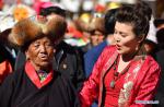 Mar. 25, 2019 -- Villager Yanggim (L) sings with a singer in Khesum Village, Nedong of Shannan, southwest China`s Tibet Autonomous Region, March 20, 2019. Khesum was the starting point of sweeping democratic reform in 1959, which ended feudal serfdom under theocracy and began a new chapter for the plateau region in southwest China. (Xinhua/Chogo)