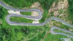 April 8, 2019 -- Aerial photo taken on Aug. 12, 2018 shows a winding mountain road in Gyirong County, southwest China`s Tibet Autonomous Region. According to the white paper `Democratic Reform in Tibet -- Sixty Years On` issued in March of 2019, by the end of 2018, Tibet had 97,800 km of highway, 660 km of which were high-grade highways. All counties in Tibet had access to highways, and of the 697 townships and towns, 579 had direct access to highway transport and 696 could be reached by highways. Of the 5,467 villages in Tibet, 2,624 had direct access to highway transport and 5,457 could be reached by highway. In 2006, the Golmud-Lhasa section of the Qinghai-Tibet Railway was completed and opened to traffic, which was the first railway in Tibet. In 2014, the construction of Lhasa-Shigatse Railway was completed and tracklaying started on the Lhasa-Nyingchi Railway. (Xinhua/Liu Dongjun)
