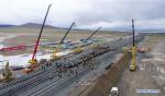 April 8, 2019 -- Aerail photo taken on July 26, 2017 shows the construction site of the Golmud-Lhasa section of the Qinghai-Tibet railway in southwest China`s Tibet Autonomous Region. According to the white paper `Democratic Reform in Tibet -- Sixty Years On` issued in March of 2019, by the end of 2018, Tibet had 97,800 km of highway, 660 km of which were high-grade highways. All counties in Tibet had access to highways, and of the 697 townships and towns, 579 had direct access to highway transport and 696 could be reached by highways. Of the 5,467 villages in Tibet, 2,624 had direct access to highway transport and 5,457 could be reached by highway. In 2006, the Golmud-Lhasa section of the Qinghai-Tibet Railway was completed and opened to traffic, which was the first railway in Tibet. In 2014, the construction of Lhasa-Shigatse Railway was completed and tracklaying started on the Lhasa-Nyingchi Railway. (Xinhua/Liu Dongjun)