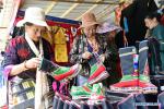 June 3, 2019 -- Customers choose Tibetan boots during an international border trade, tourism and culture festival in Yadong County, southwest China`s Tibet Autonomous Region, June 2, 2019. An international border trade, tourism and culture festival kicked off in Yadong County on Sunday. A series of events including exhibitions, fitness programs and investment promotions will be held in the week-long festival. (Xinhua/Zhang Rufeng)