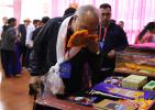 June 19, 2019 -- The delegates admire Tibetan characteristic handicrafts.