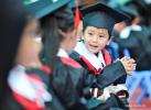 July 19, 2019 -- Children chat at the graduation day from kindergarten in Lhasa, capital of Tibet Autonomous Region, July 12, 2019. [Photo/Xinhua]