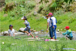 July 22, 2019 -- Tourists have fun near a stream in Dagdong Village in Lhasa, southwest China`s Tibet Autonomous Region, July 20, 2019. Dagdong Village, once a poverty-stricken village, has a history of over 1,000 years. In recent years, Dagdong promoted culture and tourism industry as a targeted measure in poverty alleviation campaigns. (Xinhua/Zhang Rufeng)