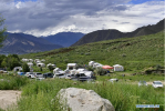 July 22, 2019 -- Photo taken on July 20, 2019 shows tents and vehicles in Dagdong Village in Lhasa, southwest China`s Tibet Autonomous Region. Dagdong Village, once a poverty-stricken village, has a history of over 1,000 years. In recent years, Dagdong promoted culture and tourism industry as a targeted measure in poverty alleviation campaigns. (Xinhua/Zhang Rufeng)