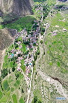 July 22, 2019 -- Aerial photo taken on July 20, 2019 shows the Dagdong Village in Lhasa, southwest China`s Tibet Autonomous Region. Dagdong Village, once a poverty-stricken village, has a history of over 1,000 years. In recent years, Dagdong promoted culture and tourism industry as a targeted measure in poverty alleviation campaigns. (Xinhua/Purbu Zhaxi)