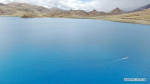 July 24, 2019 -- Aerial photo taken on July 22, 2019 shows a Chinese scientific expedition team taking a boat to the main area of Lake Yamzhog Yumco for survey in Nanggarze County of Shannan, southwest China`s Tibet Autonomous Region. Chinese scientists are working on a survey to measure the depth of a major lake in southwest China`s Tibet Autonomous Region, sources with the Chinese Academy of Sciences (CAS) said Tuesday. Lake Yamzhog Yumco with an area of about 590 square km is located in Nanggarze County in the city of Shannan. Yamzhog Yumco along with Lake Namtso and Lake Manasarovar are regarded as the three holy lakes of Tibet. (Xinhua/Jigme Dorje)