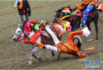 Aug.1, 2019 -- A herdsman performs stunts on horseback during a horse racing festival. The festival kicked off on Tuesday in Bayi Racecourse, Litang County of Ganzi Tibetan Autonomous Prefecture in southwest China’s Sichuan province. Nearly 1,000 herdsmen participated in horse riding and performed stunning stunts, such as picking up hadas while riding a horse, horseback archery, bringing great enjoyment to local people and visitors.(Xinhua/Jiang Hongjing)(Translate by Gao Jingna)