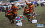 Aug.1, 2019 -- Two herdsmen perform horseback archery during a horse racing festival. The festival kicked off on Tuesday in Bayi Racecourse, Litang County of Ganzi Tibetan Autonomous Prefecture in southwest China’s Sichuan province. Nearly 1,000 herdsmen participated in horse riding and performed stunning stunts, such as picking up hadas while riding a horse, horseback archery, bringing great enjoyment to local people and visitors. (Xinhua/Jiang Hongjing)(Translate by Gao Jingna)