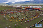 Aug.1, 2019 -- People perform Guozhuang Dance at the opening ceremony of a horse racing festival. The festival kicked off on Tuesday in Bayi Racecourse, Litang County of Ganzi Tibetan Autonomous Prefecture in southwest China’s Sichuan province. Nearly 1,000 herdsmen participated in horse riding and performed stunning stunts, such as picking up hadas while riding a horse, horseback archery, bringing great enjoyment to local people and visitors. (Xinhua/Jiang Hongjing)(Translate by Gao Jingna)