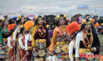Aug.2, 2019 -- Tibetans watch the Guozhuang dance, otherwise known as the Tibetan bonfire dance, at a horse racing festival in Litang County, Southwest China`s Sichuan Province, July 31, 2019. Guozhuang in Tibetan is homophonic with Guozhuo, which means to sing and dance in a circle. (Photo: China News Service/Liu Zhongjun)