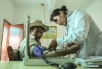 Aug.6, 2019 -- Village doctor Zhoima (R) conducts a medical checkup for a villager at the health room in Wuqang Village of Dongmar Township in Rutog County, Ngari Prefecture, southwest China`s Tibet Autonomous Region, Aug. 3, 2019. Born in 1979, Zhoima has been a village doctor in Wuqang for more than 20 years. It is estimated that each year she provides more than 600 diagnoses and treatment to villagers, regardless of the weather and journey. (Xinhua/Jigme Dorje)