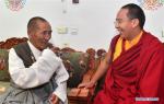 Aug.6, 2019 -- The 11th Panchen Lama (R) visits an elderly resident by the name of Gama in Ali Prefecture of southwest China`s Tibet Autonomous Region, July 28, 2019. Bainqen Erdini Qoigyijabu, the 11th Panchen Lama, who is also a member of the Standing Committee of the Chinese People`s Political Consultative Conference (CPPCC) National Committee and vice president of the Buddhist Association of China, recently went on a research tour on the society in Ali Prefecture. (Xinhua/Chogo)