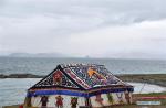 Aug.12, 2019 -- Photo taken on Aug. 7, 2019 shows a tent used for worshiping on the bank of Nam Co Lake in southwest China`s Tibet Autonomous Region. (Xinhua/Chogo)