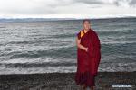 Aug.12, 2019 -- The 11th Panchen Lama Bainqen Erdini Qoigyijabu, also vice president of the Buddhist Association of China, poses for a photo on the bank of Nam Co Lake in southwest China`s Tibet Autonomous Region, Aug. 7, 2019. (Xinhua/Chogo)