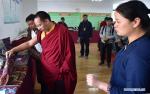 Aug.30, 2019 -- The 11th Panchen Lama Bainqen Erdini Qoigyijabu, also a member of the Standing Committee of the Chinese People`s Political Consultative Conference (CPPCC) National Committee and vice president of the Buddhist Association of China, views handicrafts as he visits Jilung County, southwest China`s Tibet Autonomous Region, Aug. 22, 2019. The Panchen Lama went on a research tour and attended Buddhist activities in Jilung from Aug. 19 to 24. (Xinhua/Chogo)