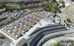 Sept.23, 2019 -- Aerial photo taken on Sept. 21, 2019 shows the government-funded dwellings in Lhozhag Town of Lhozhag County, Shannan City, southwest China`s Tibet Autonomous Region. A total of 88 villagers from 28 households moved to their new two-story dwellings to improve housing conditions. (Xinhua/Jigme Dorje)