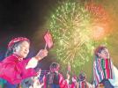 Oct.11, 2019 -- Photo shows people enjoying the National Day fireworks display. [China Tibet News/Chen Lin  Tashi Dondrup  Zhang Bin]