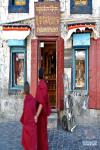 Oct. 23, 2019 -- Two monks walk past the Syamukapu Nepali Shop in Lhasa, southwest China`s Tibet Autonomous Region, Oct. 14, 2019. Covering an area of no more than 100 square meters, a century-old store catches the eyes of pedestrians in Barkhor Street in central Lhasa, with its traditional Tibetan furnishing on the front and a sign inscribed with the name in Tibetan, Chinese and English -- Syamukapu Nepali Shop. (Xinhua/Li Xin)