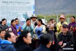 Oct.30, 2019 -- Villagers applaud during the `apple conference` held at a village in Mainling County of Nyingchi City, southwest China`s Tibet Autonomous Region, Oct. 26, 2019. The `apple conference`, a training session on the apple business, was held here on Saturday, where more than 20 technicians from Qamdo, Shannan and Nyingchi as well as local villagers received on-site training provided by specialists and discussed about new species and technologies. (Xinhua/Li Xin)