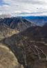 Nov.15,2019 -- Aerial photo taken on Oct. 23, 2019 shows part of Nujiang River zigzag road on the Sichuan-Tibet highway in Baxoi County, southwest China`s Tibet Autonomous Region. The Sichuan-Tibet highway, which was put into operation on Dec. 25, 1954 and has a length of over 2,000 kilometers. Over the past 65 years, the central and local governments have invested heavily to lift the highway`s traffic capacity and safety. Besides more tunnels and bridges, almost all sections of the highway have been widened and asphalted. (Xinhua/Jiang Hongjing)