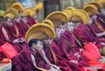 Dec.23,2019 -- Monks attend an event at the Jokhang Temple in Lhasa, capital of Southwest China`s Tibet autonomous region, Dec.21, 2019. People of the Tibetan ethnic group lit butter lamps and prayed through the night in the annual Butter Lamp Festival commemorating Tsong Khapa, a master of Tibetan Buddhism. [Photo/Xinhua]