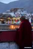 Dec.23,2019 -- A monk lights butter lamps at the Jokhang Temple in Lhasa, capital of Southwest China`s Tibet autonomous region, Dec.21, 2019. [Photo/Xinhua]