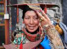 Dec.24,2019 -- A woman wears Burang clothes in Burang County of Ali, southwest China`s Tibet Autonomous Region, July 22, 2019. Burang clothes has a history of more than 1,000 years. It is decorated with gold, silver, pearls and other jewels. From scientific expedition at the Lake Yamzbog Yumco to wildlife conservation patrol mission in Shuanghu County at an average altitude of more than 5,000 meters, from a traditional festive horse racing to annual facelift of the Potala Palace, the photographers of Xinhua captured local people`s daily lives and achievements on social development in Tibet in 2019, the year marking the 60th anniversary of the campaign of democratic reform in Tibet. A selection of photos from the `InTibet` column shows beauty of nature on the plateau and stories of local people improving their lives with hard work. (Xinhua/Chogo)