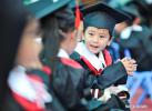 Dec.24,2019 -- Children chat at the graduation ceremony of a kindergarten in Lhasa, capital city of southwest China`s Tibet Autonomous Region, July 12, 2019. From scientific expedition at the Lake Yamzbog Yumco to wildlife conservation patrol mission in Shuanghu County at an average altitude of more than 5,000 meters, from a traditional festive horse racing to annual facelift of the Potala Palace, the photographers of Xinhua captured local people`s daily lives and achievements on social development in Tibet in 2019, the year marking the 60th anniversary of the campaign of democratic reform in Tibet. A selection of photos from the `InTibet` column shows beauty of nature on the plateau and stories of local people improving their lives with hard work. (Xinhua/Jigme Dorje)