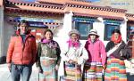Dec.25,2019 -- An 80-year-old herder (C) migrated from Shuanghu County, Nagchu City, southwest China`s Tibet Autonomous Region, stands in front of her new home with relatives on Dec. 23, 2019. A total of 2,900 residents from three villages of Shuanghu County, have recently left their hometown with an average altitude of 5,000 meters above sea level and travelled nearly 1,000 kilometers to resettle in Konggar County, which, at a relatively low altitude, is located to the south bank of the Yarlung Zangbo River in southern Tibet. (Xinhua/Chogo)