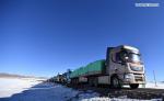 Dec.25,2019 -- Photo taken on Dec. 23, 2019 shows a fleet of trucks carrying belongings of herders migrating from Shuanghu County, Nagchu City, southwest China`s Tibet Autonomous Region. A total of 2,900 residents from three villages of Shuanghu County, have recently left their hometown with an average altitude of 5,000 meters above sea level and travelled nearly 1,000 kilometers to resettle in Konggar County, which, at a relatively low altitude, is located to the south bank of the Yarlung Zangbo River in southern Tibet. (Xinhua/Chogo)