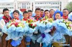 Jan.9,2020 -- Students attend a graduation ceremony at a primary school in Lhasa, southwest China`s Tibet Autonomous Region, May 31, 2019. A total of 27.2 billion yuan (about 3.9 billion U.S. dollars) was put into education in Tibet in 2019. (Xinhua/Purbu Zhaxi)