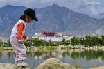 Jan.10,2020 -- A child plays by a lake at Nanshan Park in Lhasa, capital of southwest China`s Tibet Autonomous Region, July 30, 2019. More than 40 million tourists from home and abroad visited southwest China`s Tibet Autonomous Region in 2019, up 19 percent year on year, according to local authorities. In 2019, tourism revenue rose to 56 billion yuan (7.9 billion U.S. dollars), Qizhala, chairman of the regional government, said in his government work report delivered on Jan. 7, 2020 at the third session of the 11th People`s Congress of Tibet Autonomous Region. (Xinhua/Zhang Rufeng)
