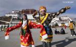 Jan.10,2020 -- Tourists wearing Tibetan costumes pose for photos at the Potala Palace square in Lhasa, capital city of southwest China`s Tibet Autonomous Region, Jan. 1, 2019. More than 40 million tourists from home and abroad visited southwest China`s Tibet Autonomous Region in 2019, up 19 percent year on year, according to local authorities. In 2019, tourism revenue rose to 56 billion yuan (7.9 billion U.S. dollars), Qizhala, chairman of the regional government, said in his government work report delivered on Jan. 7, 2020 at the third session of the 11th People`s Congress of Tibet Autonomous Region. (Xinhua/Purbu Zhaxi)