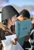 Jan.14,2020 -- A college graduate reads information during a job recruitment fair in southwest China`s Tibet Autonomous Region, on Nov. 18, 2019. In 2019, Tibet created more than 60,000 jobs for university graduates by improving employment policies and services. (Xinhua/Jigme Dorje)