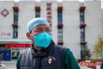 Feb.5,2020 -- Pu Qiong, an emergency department doctor is seen standing in front of the Third People`s Hospital of Tibet, a designated hospital for novel coronavirus in Lhasa, southwest China`s Tibet Autonomous Region, February 3，2020. Tibet reported the first confirmed case of novel coronavirus pneumonia on January 28, 2020. （Photo: China News Service/ He Penglei
