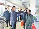Feb.11,2020 -- A police is taking the masses` temperatures at the certificate office of Law Enforcement Investigation Detachment of Tibet Exit and Entry Border Inspection Station. [Photo/Tang Rui]