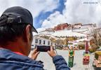 March 2,2020 -- A tour guide speaks during a live streaming tour in the Potala Palace, a UNESCO world heritage, in Lhasa, southwest China`s Tibet Autonomous Region, March 1, 2020. The Potala Palace, a landmark in southwest China`s Tibet Autonomous Region, held a live streaming tour session Sunday, the first time in its over 1,300-year history. (Xinhua/Chun La)