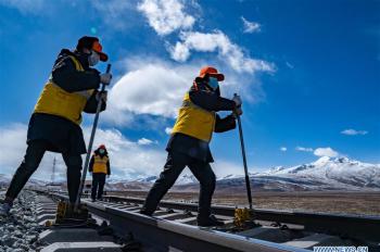 Maintenance workers stick to posts to ensure transportation safety in Tibet