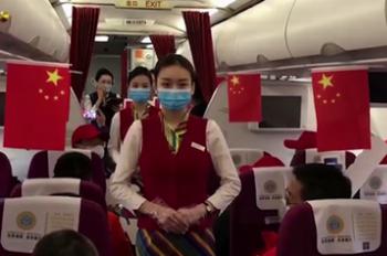 Flight attendants perform gesture dance for staff resuming work in Tibet, China