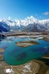 March 26,2020 -- A drone picture taken on March 24, 2020, shows snow scenery at Yajiang Valley, Tibet autonomous region. A snowfall laid over Lhasa city and its surrounding area yesterday, and banks along the Yarlung Zangbo River were enveloped with a silver covering, shimmering under the sun. [Photo/Xinhua]