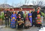 March 30,2020 -- Sonam Drolma and her family pose for a group photo in Reguo Village of Gyaca County in Shannan, southwest China`s Tibet Autonomous Region, March 24, 2020. Saturday marks the Serfs` Emancipation Day. Sixty-one years ago, more than one million people, or 90 percent of the region`s population of that time, were liberated from the feudal serfdom. Sonam Drolma is a 109-year-old villager in Reguo Village of Shannan. Since she was born, she has gone through half a century of twists and turns and sufferings as a serf. As a descendant of serfs, Sonam Drolma began to work for serf owners at the age of 15. Sonam served as a serf for 47 years, witnessing her parents and brother die at an early age because of the overwork and poor living conditions. After the democratic reform, she owned the land, houses, cattle and sheep that she had never dreamed of. Since then, she never had to live the life being exploited and oppressed. Then Sonam Drolma gave birth to her daughter. After China`s reform and opening up in early 1980s, Sonam Drolma`s daughter Tsering Dzongpa picked up the baton of the family, going all out to make the family shake off poverty and have a well-off life by hard working. Sonam`s family first contracted 11 mu (about 0.73 hectare) of land and seven walnut trees in the village. Then Tsering Dzongpa started to make a living by woolen weaving. Hard work brings rich returns. The family bought walking tractors, winnowing machines and other machinery one by one, and became the first family in the village to buy a car. Nowadays, Sonam`s family produces more than 5,000 kilograms of grain and 700 kilograms of walnuts annually. If taking the income of woolen weaving into account, the annual income of her family is close to 100,000 yuan (about 14,096 U.S. dollars). The family has expanded their houses for five times. In 2017, they even spent 540,000 yuan (about 76,118 U.S. dollars) to build a new house with an area of 520 square meters. (Xinhua/Jigme Dorje) (Xinhua/Jigme Dorje)