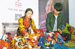 April 3,2020 -- Photo shows workers displaying innovative products of a local company named Zhuo Fanlin in southwest China`s Tibet Autonomous Region. [File photo]