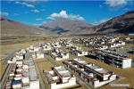 April 8,2020 -- Aerial photo taken on April 2, 2020 shows the Rongma relocation settlement in Gurum Township of Lhasa, capital of southwest China`s Tibet Autonomous Region. In 2018, more than 1,000 shepherds moved from Qiangtang grassland with an average altitude of about 5,000 meters in Rongma Township of Nagqu City to the Rongma relocation settlement, 30 kilometers west of Lhasa, thanks to the local policy on poverty alleviation. This measure also makes room for the living of wild animals at the Qiangtang National Nature Reserve. With the help of local government, the relocated people have developed the cultivation industry of yaks and sheep and other special pasture-style projects, thus increasing their incomes. (Xinhua/Zhan Yan)