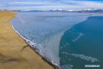 April 20,2020 -- Aerial photo taken on April 15, 2020 shows the scenery of the Puma Yumco Lake in Nagarze County of Shannan City, southwest China`s Tibet Autonomous Region. The frozen lake at an altitude of over 5,000 meters has started to thaw as the temperature rises in spring. (Xinhua/Purbu Zhaxi)