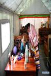 April 21,2020 -- Rolpai pours her husband Gedor a glass of Tibetan butter tea in their teahouse at a relocation site in Gangdoi Town of Gonggar County, southwest China`s Tibet Autonomous Region, April 15, 2020. Gedor, 34, used to live in a remote pastoral area in Amdo County in northern Tibet with his family. Restricted by the living conditions, they earned a living by pasture and the low income of their small grocery store. In late 2019, with the support of local authorities, 4,058 residents in Amdo and Co Nyi, two counties at a high altitude of over 4,500 meters, were relocated. Gedor and his family moved to a relocation site in Gangdoi Town of Gonggar County. The site has easy access to roads and various facilities including market, hospital and school. The convenience of new life has encouraged Gedor and his wife Rolpai to open a Tibetan butter teahouse for neighboring residents to spend leisure time. Now, Gedor and his family live a better life as their teahouse has been a popular spot with satisfactory income, and with the allowance from local authorities. (Xinhua/Zhan Yan)
