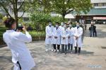 April 26,2020 -- Medical students from Tibet University pose for a group photo at the Peking University Shougang Hospital in Beijing, capital of China, April 24, 2020. A total of 17 medical students from Tibet University finished their 48-week clinical internship at the Peking University Shougang Hospital on Friday. (Xinhua/Peng Ziyang)