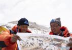 May 8,2020 -- Xue Qiangqiang (L) and his teammate view a map at the base camp of Mount Qomolangma in southwest China`s Tibet Autonomous Region, May 2, 2020. It is the first time for Xue Qiangqiang, 37, to ascend Mount Qomolangma, the world`s highest peak. He is a member of a Chinese team to remeasure the mountain`s height in May. (Xinhua/Purbu Zhaxi)