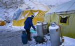May 8,2020 -- A chef warms the gas tank needed to make breakfast at the Mount Qomolangma base camp in southwest China`s Tibet Autonomous Region, May 3, 2020. China has initiated a new round of measurement on the height of Mount Qomolangma, the world`s highest peak. The measurement team arrived at the base camp one month ago, making preparation for the measurement planned in May. As an important starting point and rear base for mountaineering, the Mount Qomolangma base camp is equipped with basic living facilities and medical supplies. (Xinhua/Purbu Zhaxi)