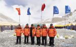 May 8,2020 -- Measurement team members pose for a photo at the Mount Qomolangma base camp in southwest China`s Tibet Autonomous Region, May 2, 2020. China has initiated a new round of measurement on the height of Mount Qomolangma, the world`s highest peak. The measurement team arrived at the base camp one month ago, making preparation for the measurement planned in May. As an important starting point and rear base for mountaineering, the Mount Qomolangma base camp is equipped with basic living facilities and medical supplies. (Xinhua/Sun Fei)